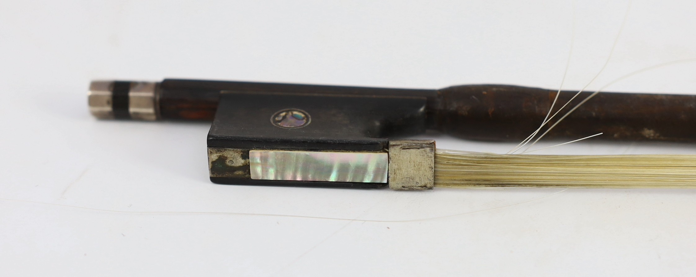 A silver mounted violin bow, stamped DODD, another stamped TOURTE and another bow
